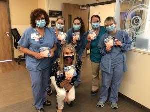 St. Clair County nurses showing off the Infant Safe Sleep book donations.